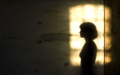 Silhouette of a lady against a lighted window, to illustrate the article Jezebel in the Bible